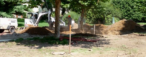 Lots of activity at the tree:  two air-tool excavators, an mini excavator digging the trench, a Bobcat taking soil away, and Matt Foti assessing progress.